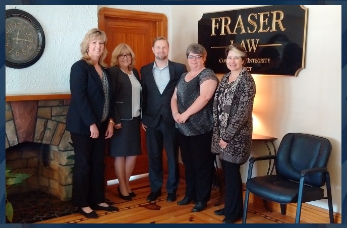 Erik M. Fraser and staff